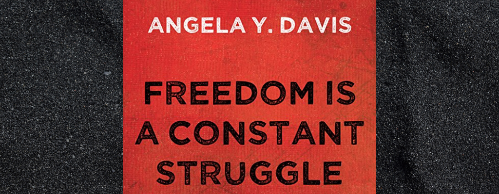 Red book cover with text reading: Angela Y Davis, Freedom Is A Constant Struggle