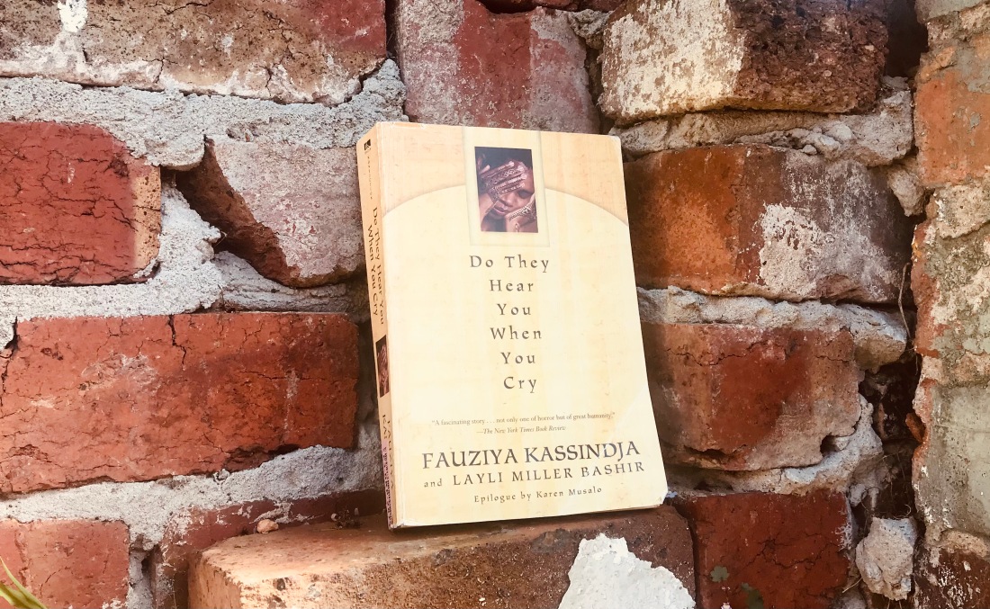 yellow book against brick wall